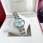 Cartier Ballon Bleu watch with light blue dial and silver link bracelet, wristwatch angle