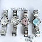 Cartier Ballon Bleu watches with light blue, white, and pink dials and silver bracelets
