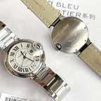 Cartier Ballon Bleu watch with light blue dial, silver case, and tan leather strap
