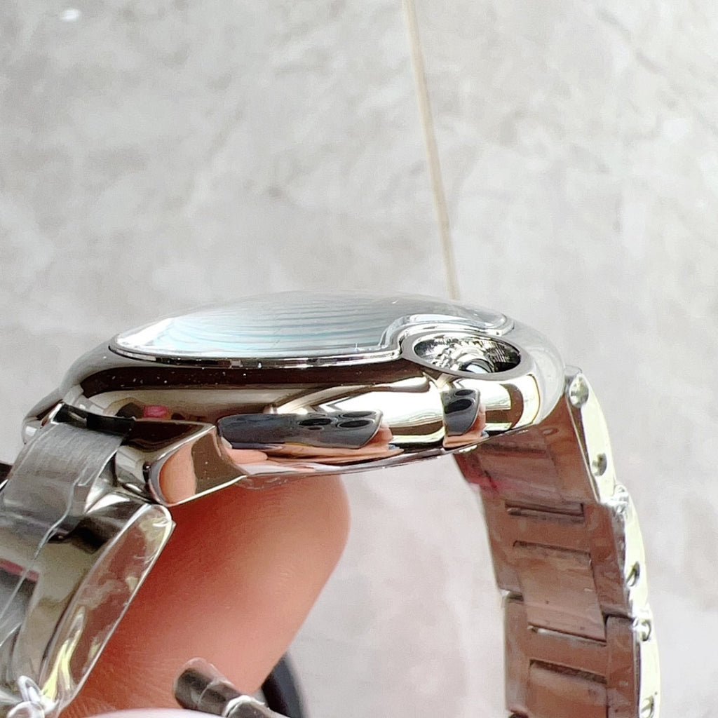 Cartier Ballon Bleu watch with silver case and link bracelet, side profile