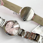 Cartier watch caseback in silver with pink leather strap, engraved metal back visible