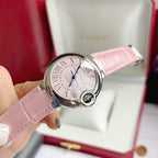 Cartier Ballon Bleu watch with pink leather strap, pink dial, Roman numerals, blue hands