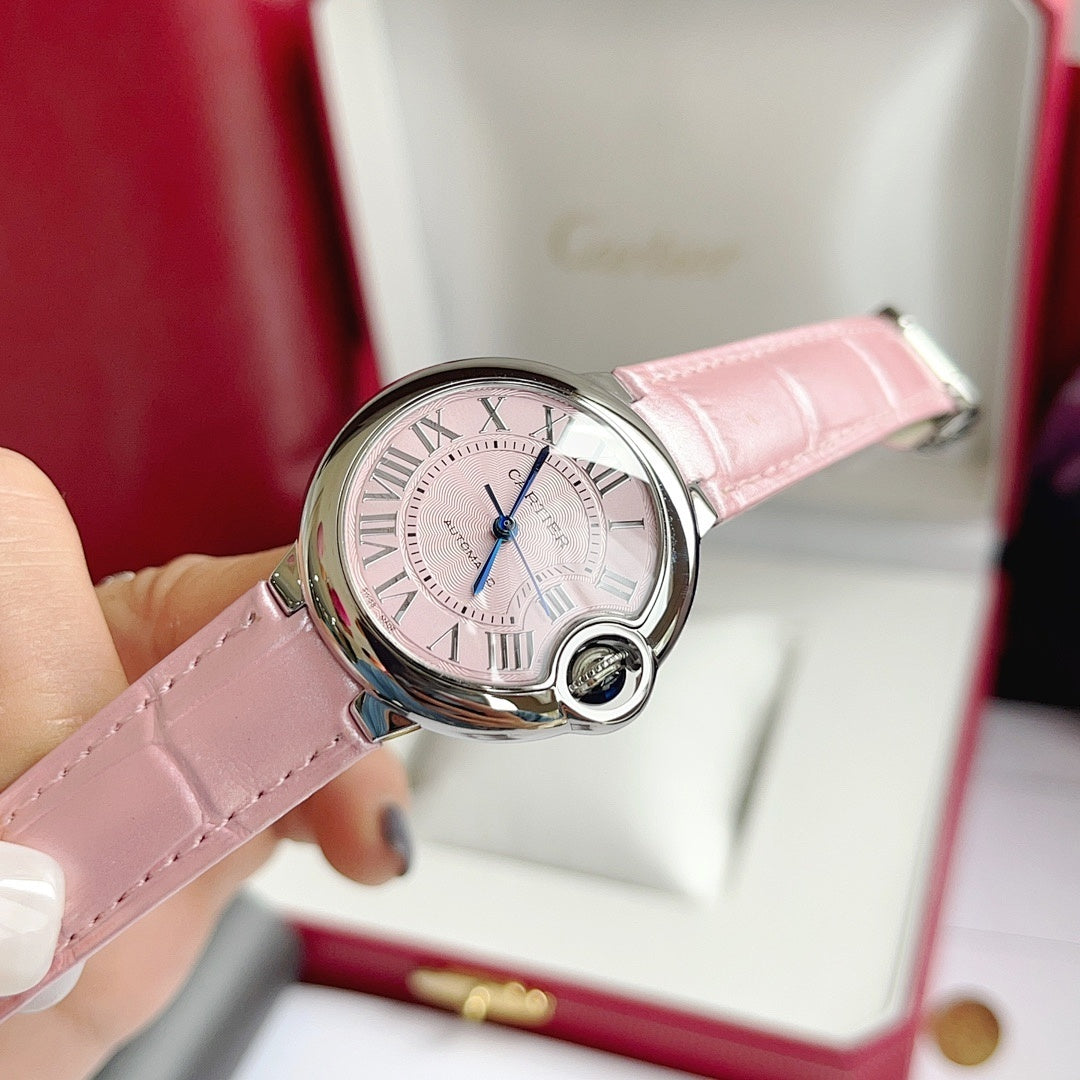 Cartier Ballon Bleu watch with pink leather strap, pink dial, Roman numerals, blue hands