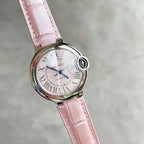 Cartier watch with pink leather strap, pink dial with Roman numerals, silver round case