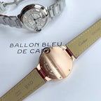 Rose-gold tone Ballon Bleu wristwatch with red leather strap and silver dial, blue hands