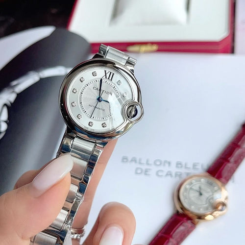 Cartier Ballon Bleu stainless steel wristwatch, silver dial, Roman numerals, blue hands