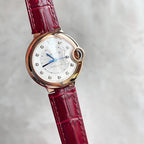 Rose-gold tone Ballon Bleu wristwatch with red leather strap, silver dial and blue hands