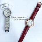 Two Ballon Bleu watches: left steel bracelet with silver dial, right red leather strap with silver dial