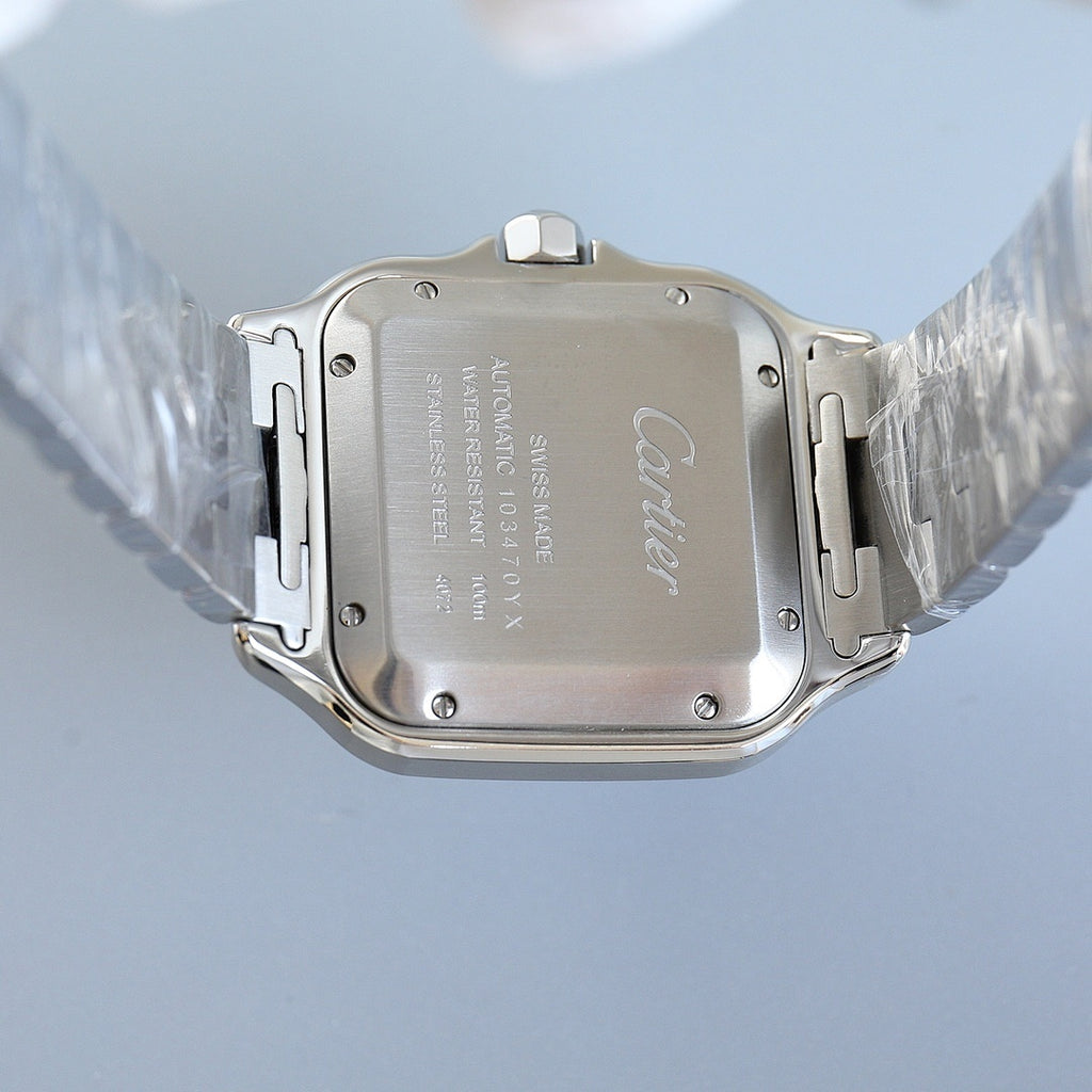 Stainless steel watch caseback with Cartier lettering and screw markers