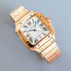 Two-tone Cartier watch with white dial and Roman numerals, angled view on bracelet