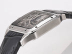 Cartier skeleton watch from the side, silver case with transparent dial and black leather strap
