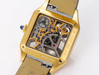 Gold-tone skeleton watch case detail with visible gears and dial, black leather strap