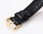 Black leather watch strap with gold-tone buckle and square gold-tone case