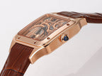 Cartier watch rose gold case side, skeleton dial and blue crown, brown strap