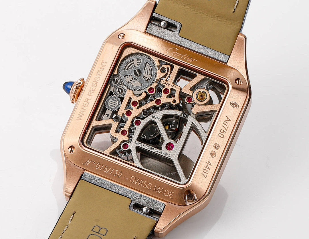 Cartier watch case back, rose-gold finish, black leather strap, visible movement details.