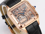 Cartier watch angled close-up, rose-gold frame, transparent dial with visible movement, black strap.