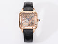 Cartier watch with rose-gold case, black leather strap, transparent skeleton dial, blue hands.