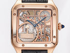 Cartier watch front dial view, rose-gold case, black leather strap, transparent skeleton movement.