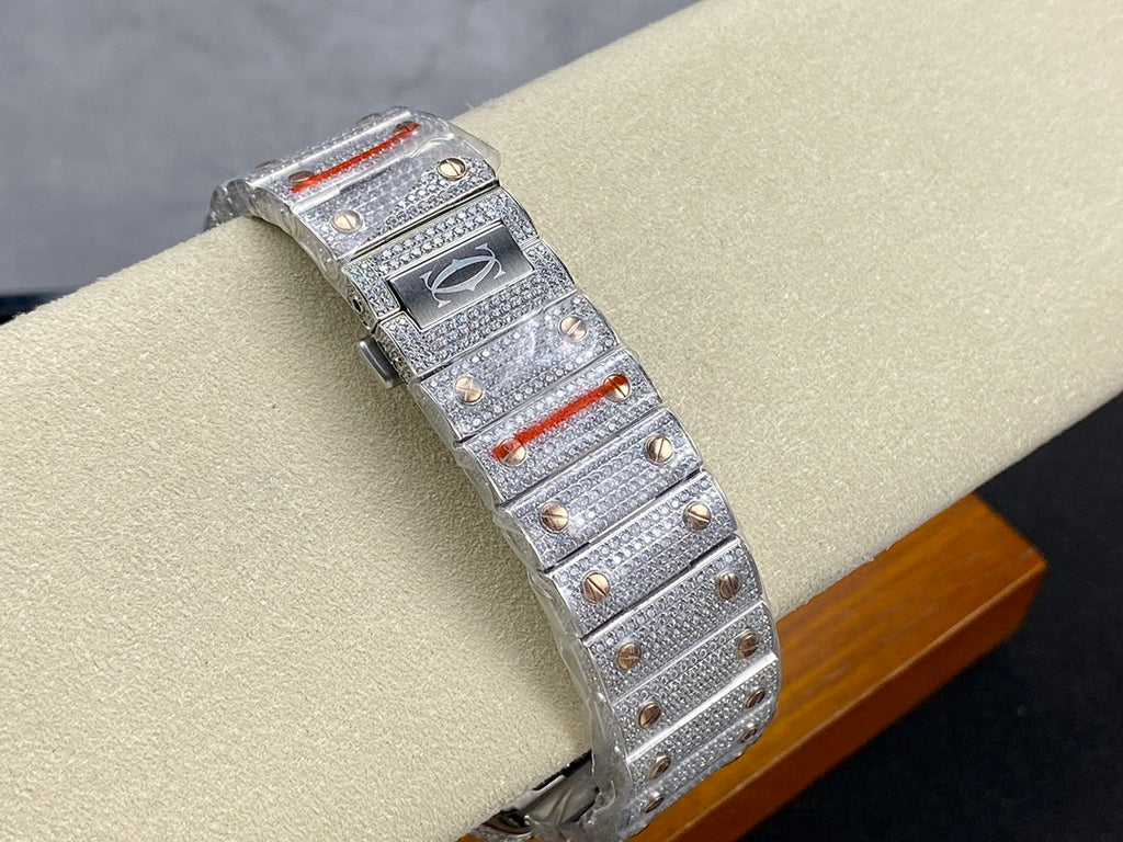 Cartier watch side view with diamond bracelet, square blue dial, and red accents