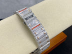 Cartier watch side view with diamond bracelet, square blue dial, and red accents