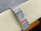 Silver diamond watch with red inset on the bracelet clasp and rectangular crown side