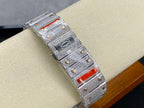 Silver diamond-set wristwatch bracelet with red insets and textured bezel detail