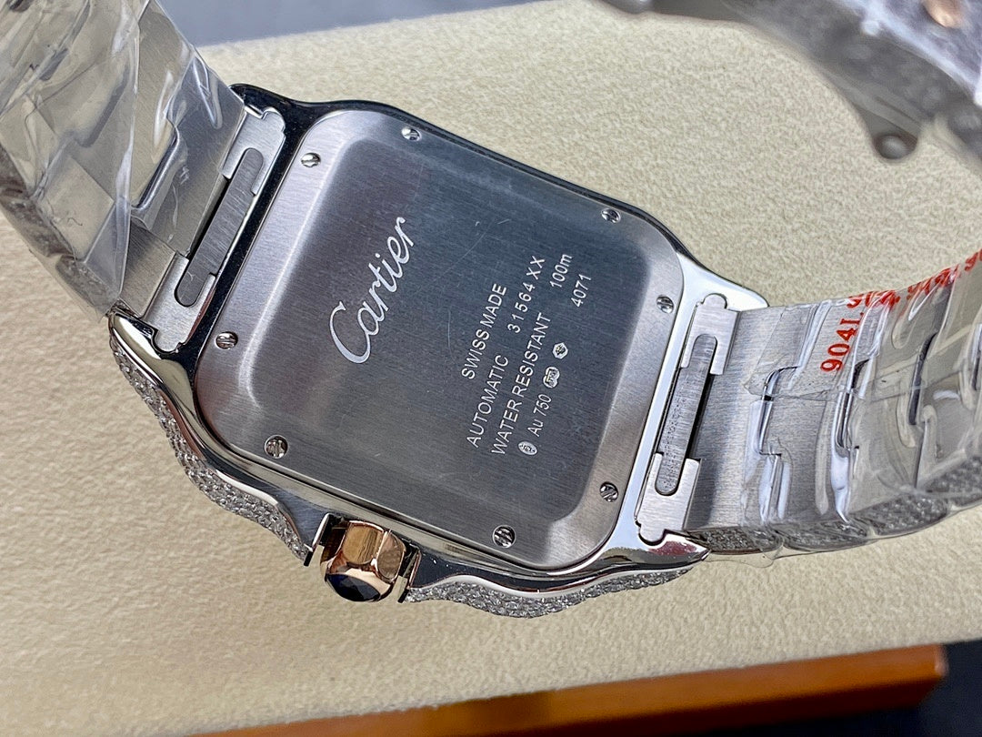 Silver metal wristwatch with engraved case back and Cartier logo on the dial