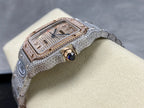 Diamond-set wristwatch with silver strap, square face, gold accents, and blue gemstone detail