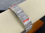 Cartier watch with silver diamond case and red striped details along the bracelet strap