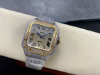Cartier watch with glittery silver strap, gold bezel, blue hands, Roman numerals and square dial