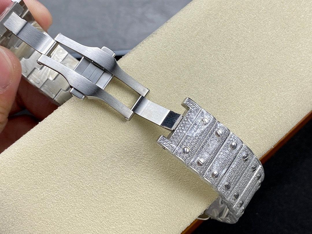 Cartier watch showing metal bracelet links and clasp with diamond-like details