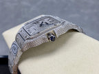 Cartier watch crown side, diamond-like bezel and round blue accent visible