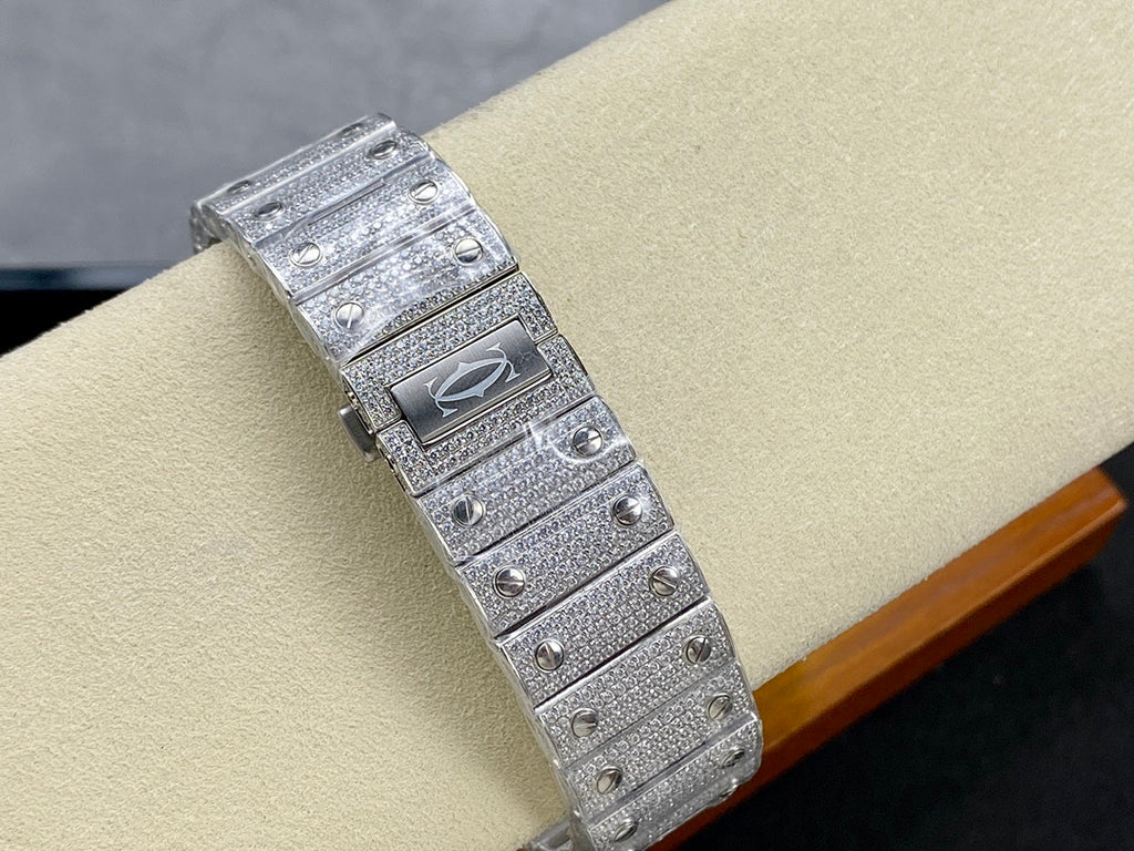 Cartier watch bracelet view with silver link strap and jeweled case back clasp detail