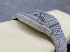 Cartier watch side angle with diamond-studded bezel, silver bracelet, AMG round emblem