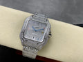 Cartier watch with rectangular jeweled case and silver dial, multicolor accents, bracelet strap