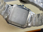 Cartier watch case back in brushed silver-tone with engraved detail, on a metal bracelet.