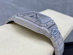 Cartier watch with jeweled frame and curved top bezel, AMG emblem on silver bracelet.