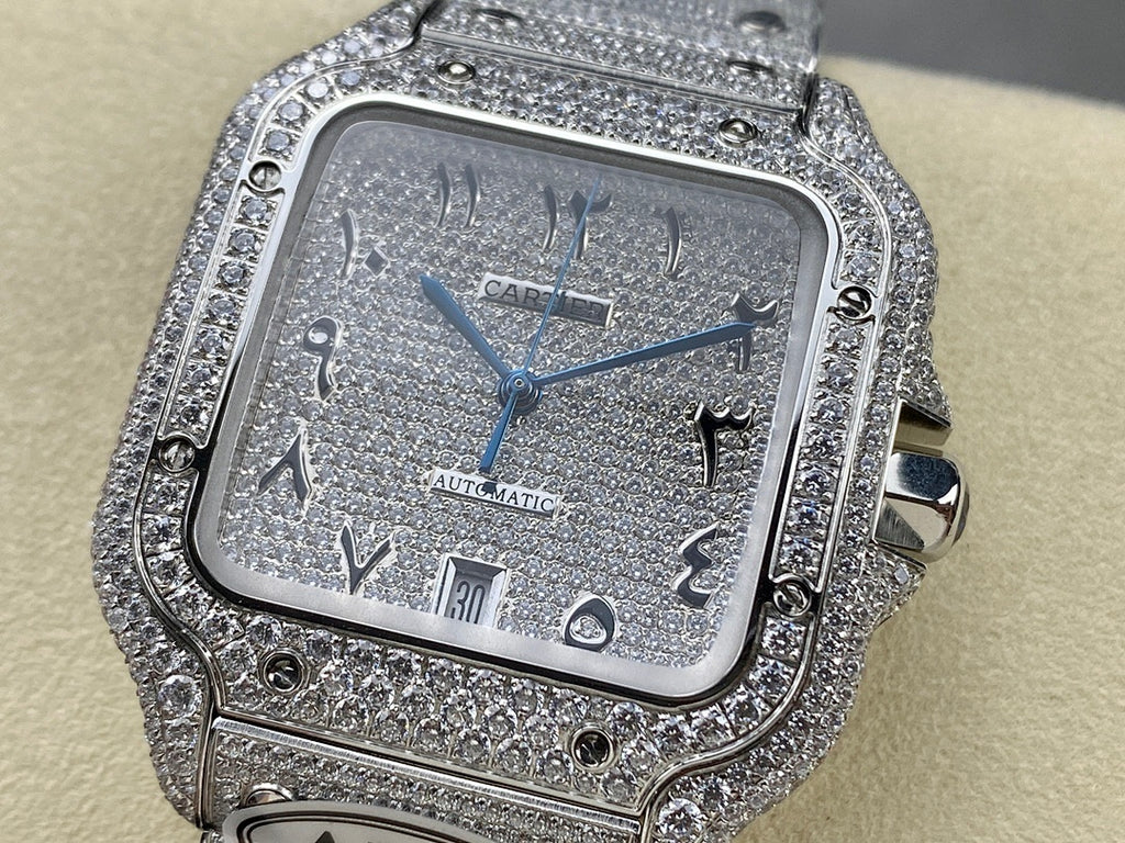 Cartier watch with sparkling silver-tone bezel, blue dial, automatic text, crown on side.