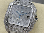Cartier watch with sparkling silver-tone bezel, blue dial, automatic text, crown on side.