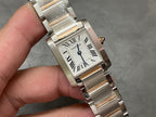 Cartier tank-style watch front close-up with Roman numeral dial and silver metal bracelet