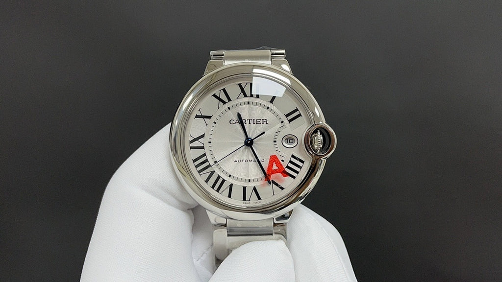 Cartier watch with silver dial, Roman numerals, blue hands, red A detail, steel bracelet