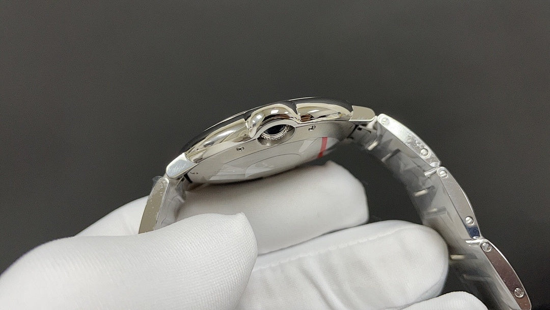 Cartier watch side view with steel case and link bracelet, crown and lug details