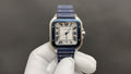 Cartier square watch with blue leather strap and silver case, Roman numeral white dial