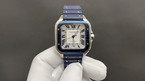 Cartier square watch with blue leather strap and silver case, Roman numeral white dial