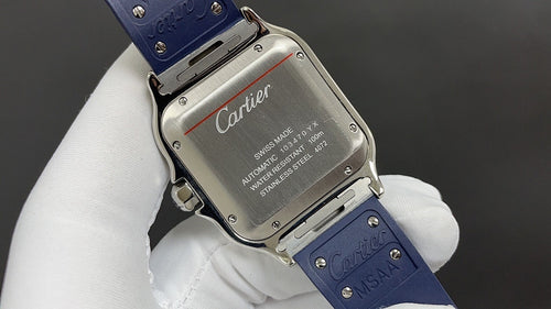 Cartier watch case back with engraved metal plate and blue leather strap