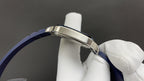 Cartier watch crown side with silver case and blue leather strap band