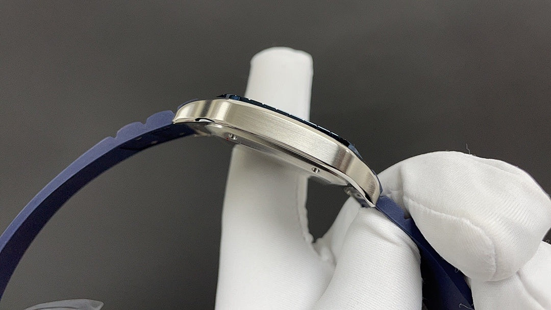 Cartier watch crown side with silver case and blue leather strap band