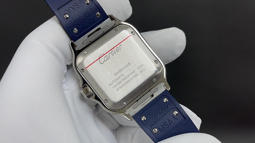 Cartier watch case back with engraved text and blue leather strap on white glove