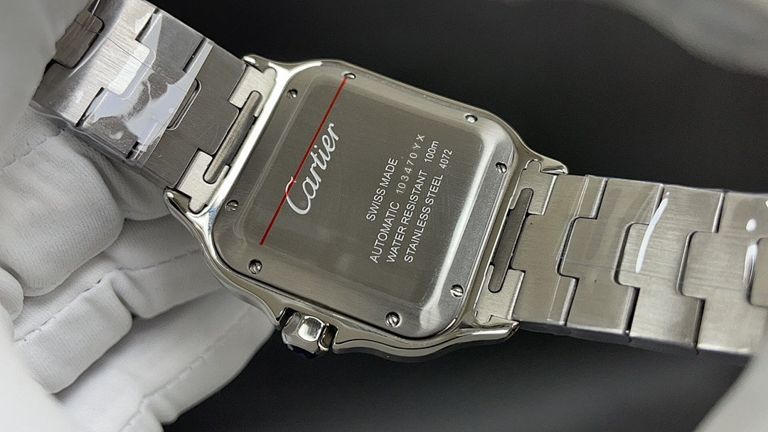 Cartier watch case back with stainless steel bracelet and clasp, engraved text panel