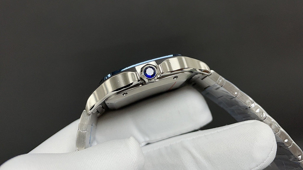 Stainless steel Cartier watch with blue gem bezel and side crown